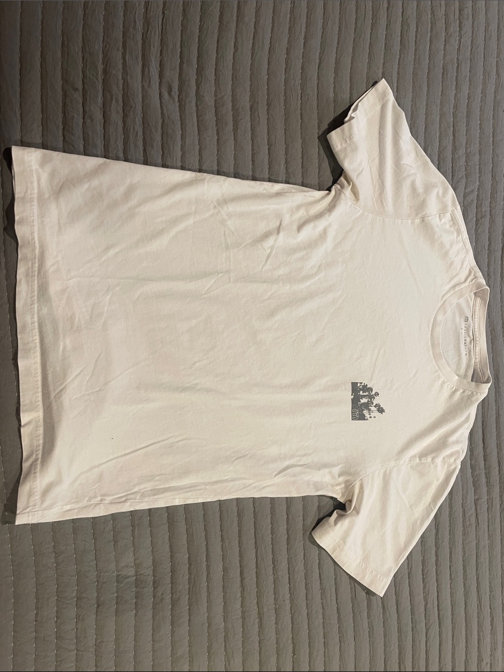 Travis Mathew Men's Crewneck Tee in Off-White with Small Chest Graphic